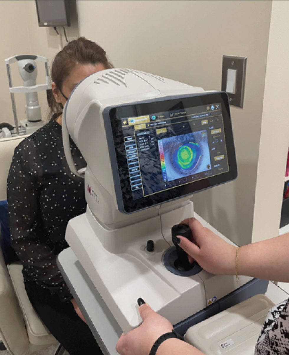 A Topcon Myah in use. The device combines axial length, dry eye testing, meibography and corneal topography in a single machine.